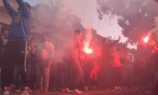 celebrators with flares in&nbsp;Cairo