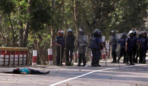 An unidentified man lies on the road during a clash between the activists of Jamaat-e-Islami, Bangladesh&rsquo;s biggest Islamist party and police in&nbsp;Dinajpur