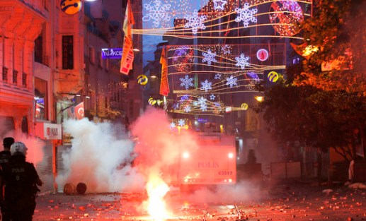 Riot police use tear gas to disperse the crowd during an anti-government protests at Taksim Square in central&nbsp;Istanbul