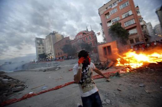 Demonstrators set fire to barricades as they clash with riot police during an anti-government protest at Taksim Square in central&nbsp;Istanbul_0