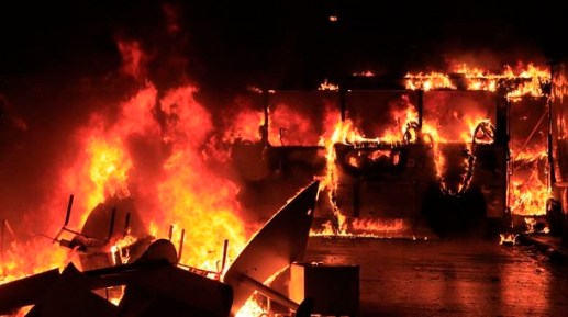 A bus burns after demonstrators from the group Black Bloc set fire to it during a protest in Rio de&nbsp;Janeiro