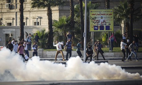 Egyptian protesters near a cloud of teargas in&nbsp;Cairo