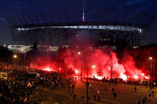 Far-right protesters throw flares in front of the National Stadium during the annual far-right rally, which coincides with Poland&rsquo;s National Independence Day in&nbsp;Warsaw