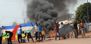 People block a road as they protest against the French "Sangaris" intervention in the Galabadia neighborhood close to the Centrafrican President's private house in the eigth district of Bangui on December 22, 2013. According to Muslim residents, clashes broke out early on December 22 between the French soldiers and the ex-Seleka fighters, who mounted a successful coup in March but have since refused to lay down their arms. They said three fighters were killed and several others were wounded, but their claims have not been confirmed by the French military. AFP PHOTO / MIGUEL MEDINA (Photo credit should read MIGUEL MEDINA/AFP/Getty Images)